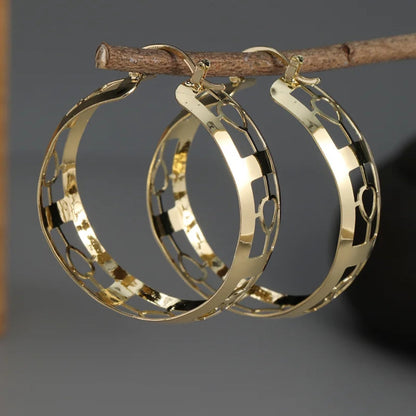 Boucles d'oreilles creuses vintage en or et argent