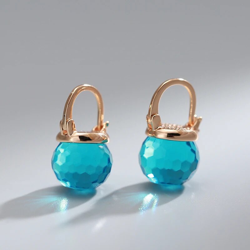 Boucles d'oreilles élégantes en forme de sphère en cristal bleu